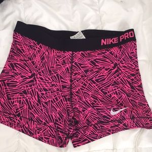 Pink and black print nike pros